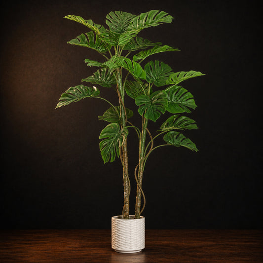 Artificial Monstera Floor Plant on a dark charcoal studio background