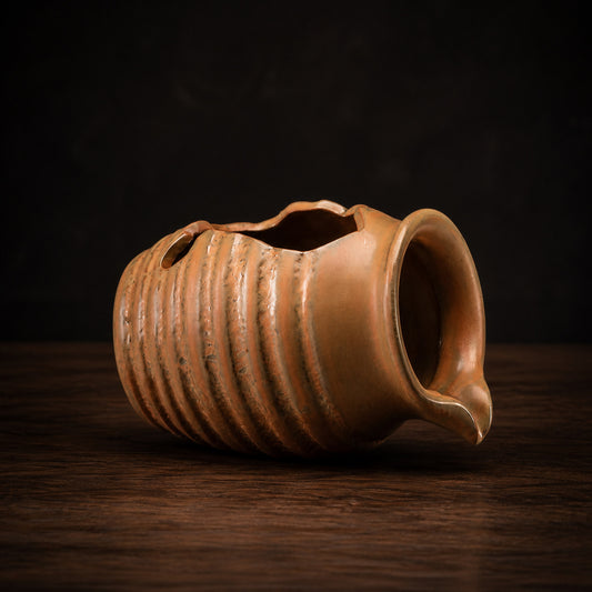 Ceramic Water Feature Jug on a dark charcoal studio background
