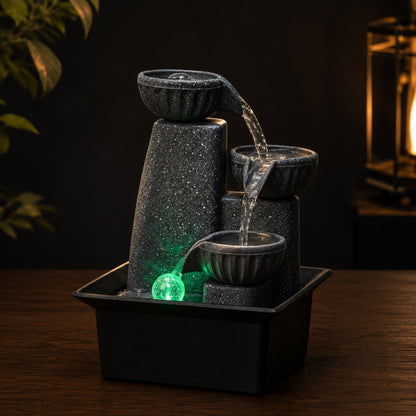 Crystal Ball Tabletop Fountain on a dark charcoal studio background