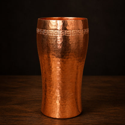 Artisan Greek-Key Copper Tumbler on a dark charcoal studio background