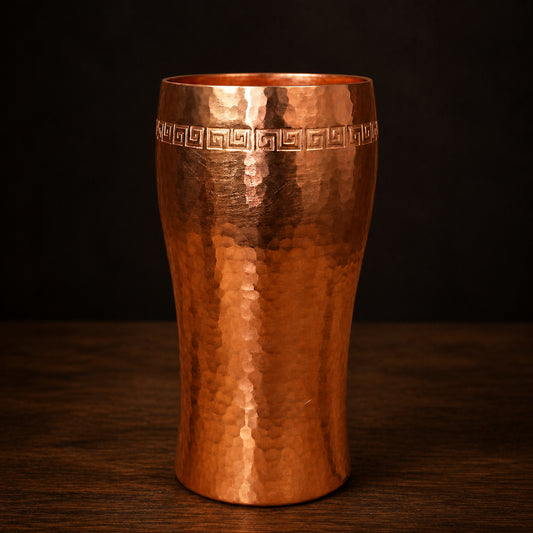 Artisan Greek-Key Copper Tumbler on a dark charcoal studio background