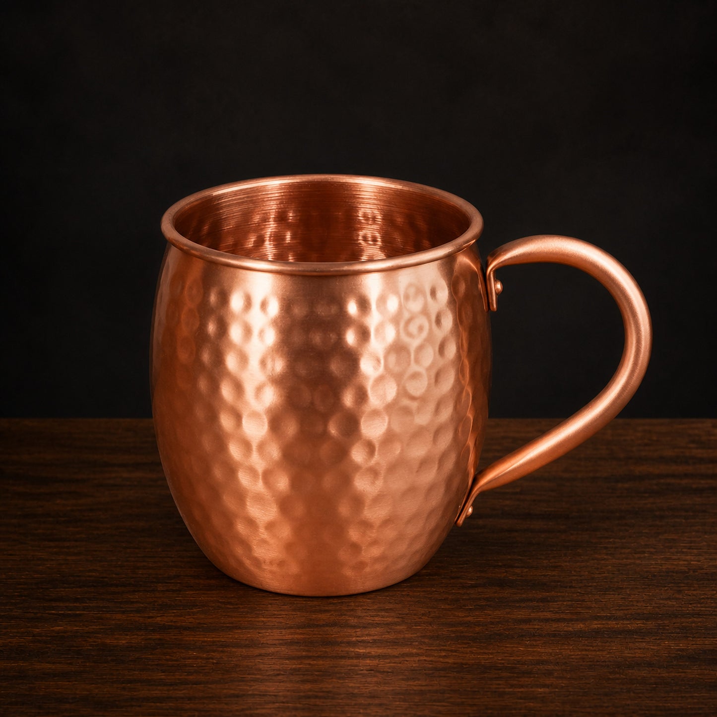 Hammered Solid Copper Mug on a dark charcoal studio background