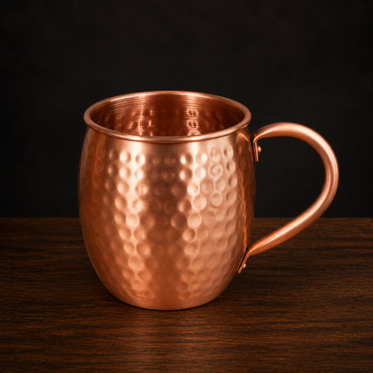 Hammered Solid Copper Mug on a dark charcoal studio background