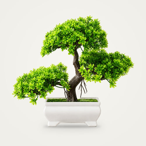 Artificial bonsai tree on a plain soft white background