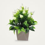 Artificial potted flower on a plain soft white background
