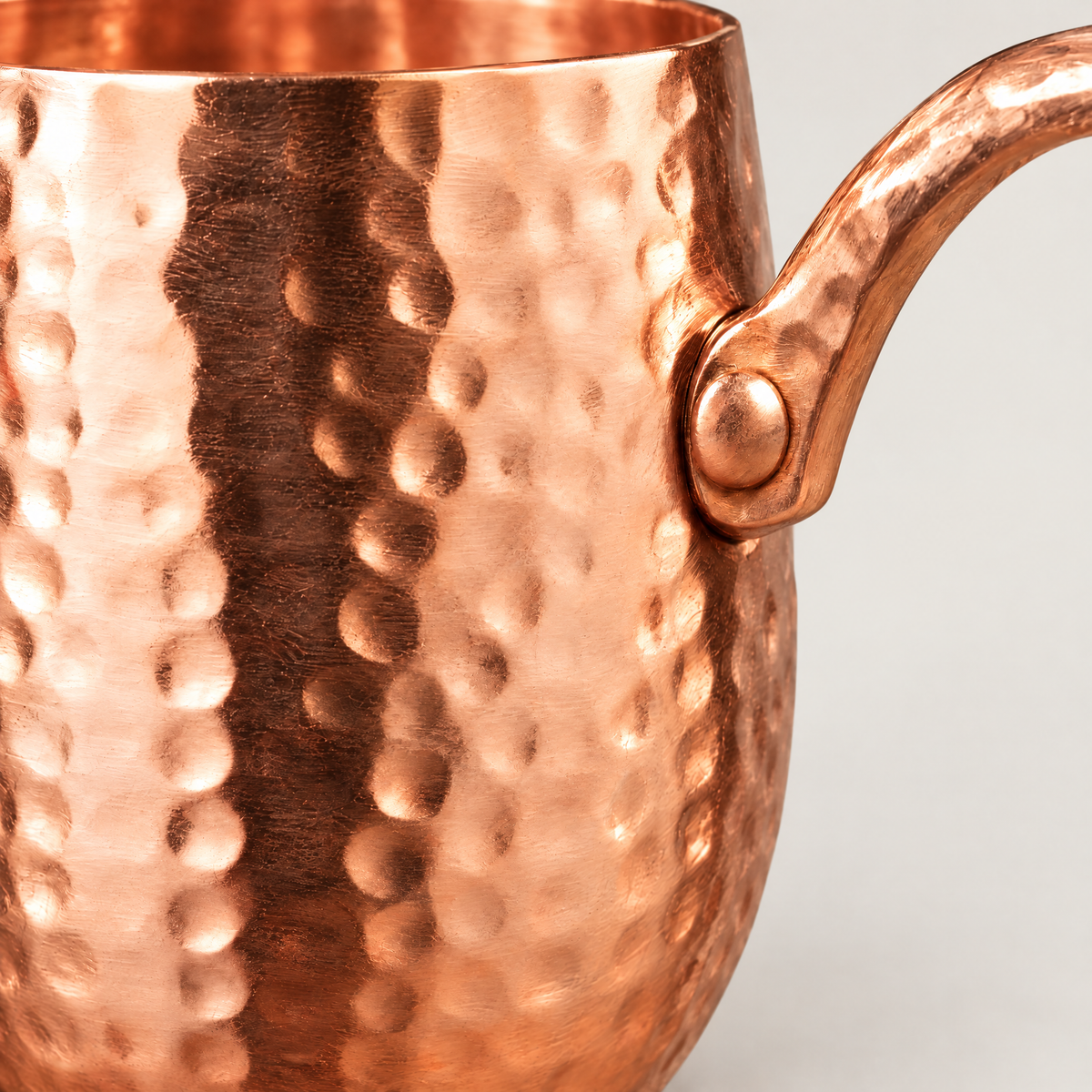 Close-up of the hammered copper finish and handle join