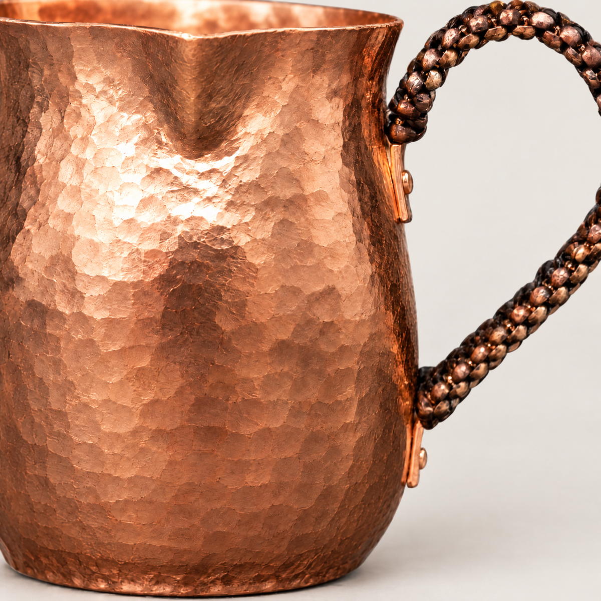Close-up of the hammered copper finish and handle join
