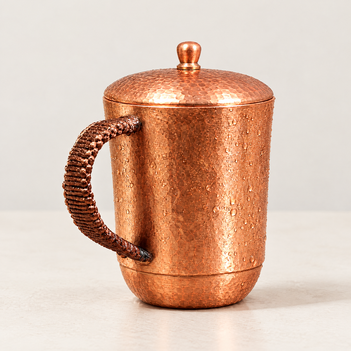 Copper tumbler filled with chilled water