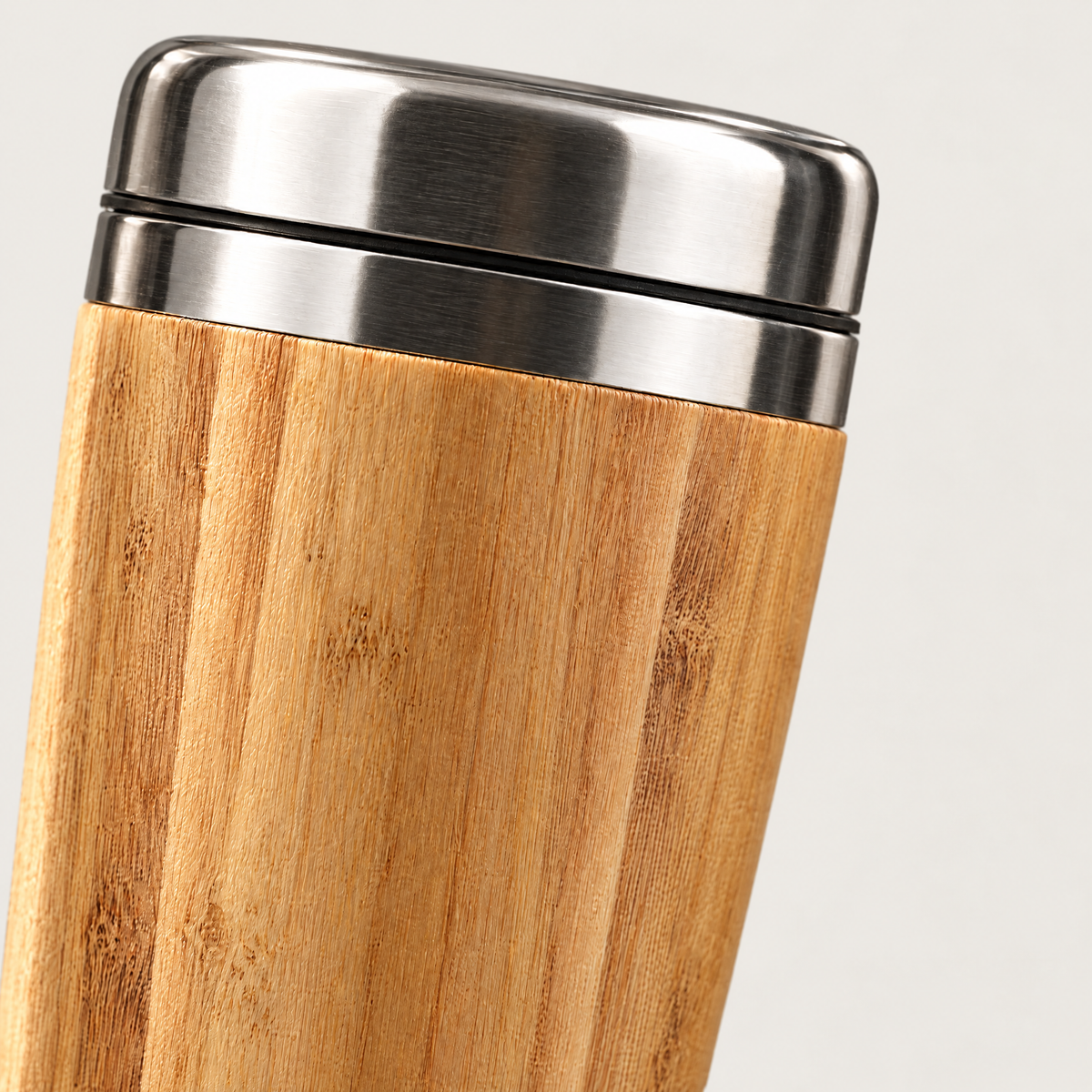 Close-up of the bamboo grain and steel lid join