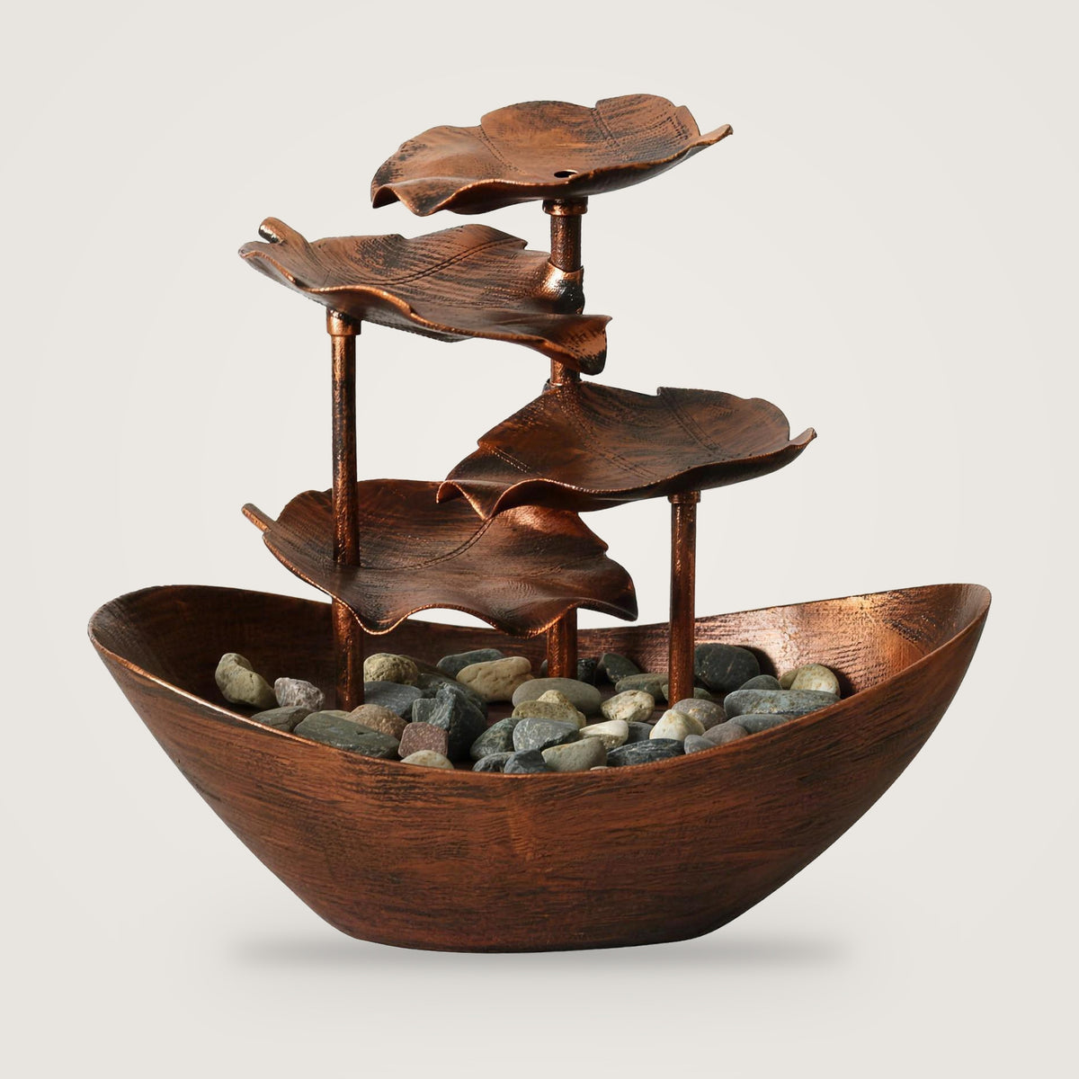 Lotus leaf tabletop water fountain, Bronze option, on a plain light grey background