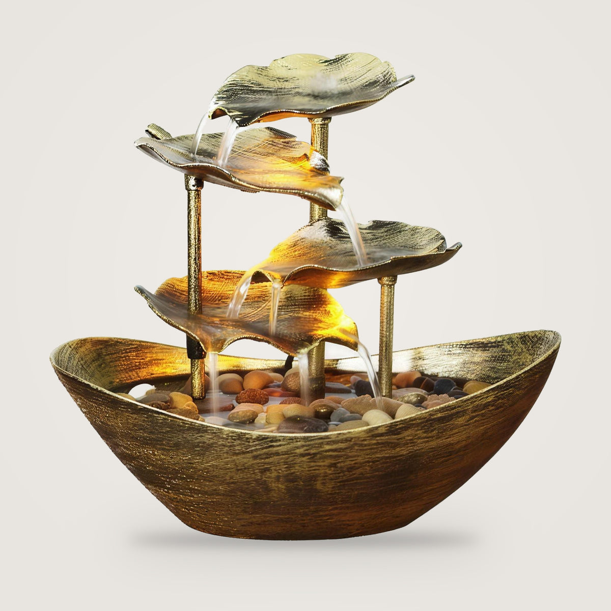 Lotus leaf tabletop water fountain, Gold option, on a plain light grey background