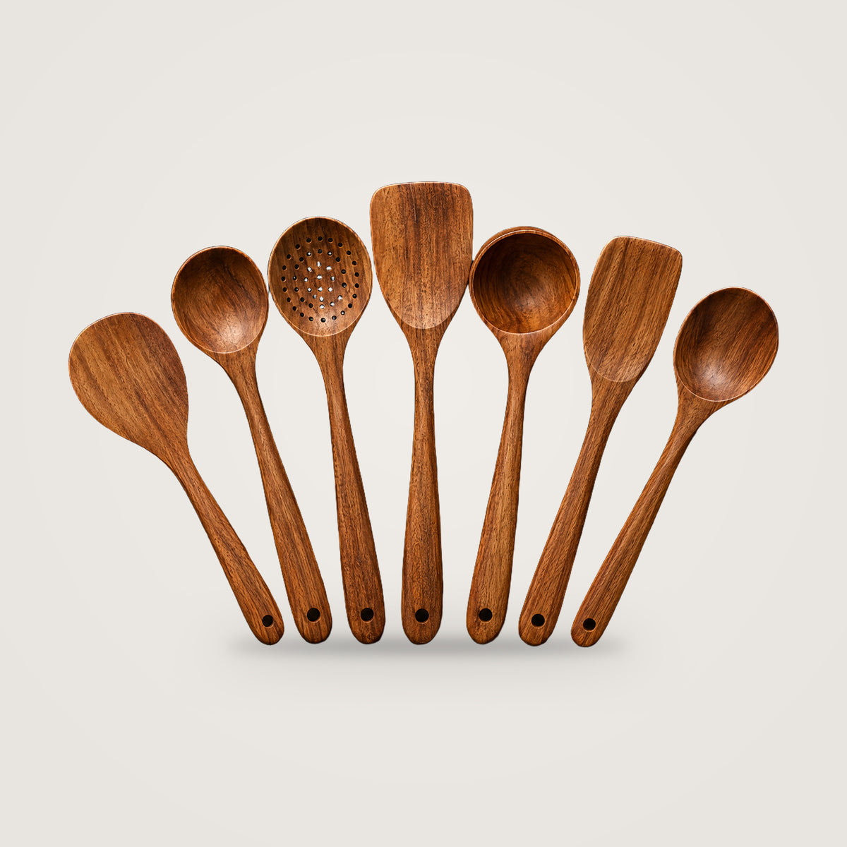 Wooden cooking utensils, 7-piece cooking set option, on a plain light grey background
