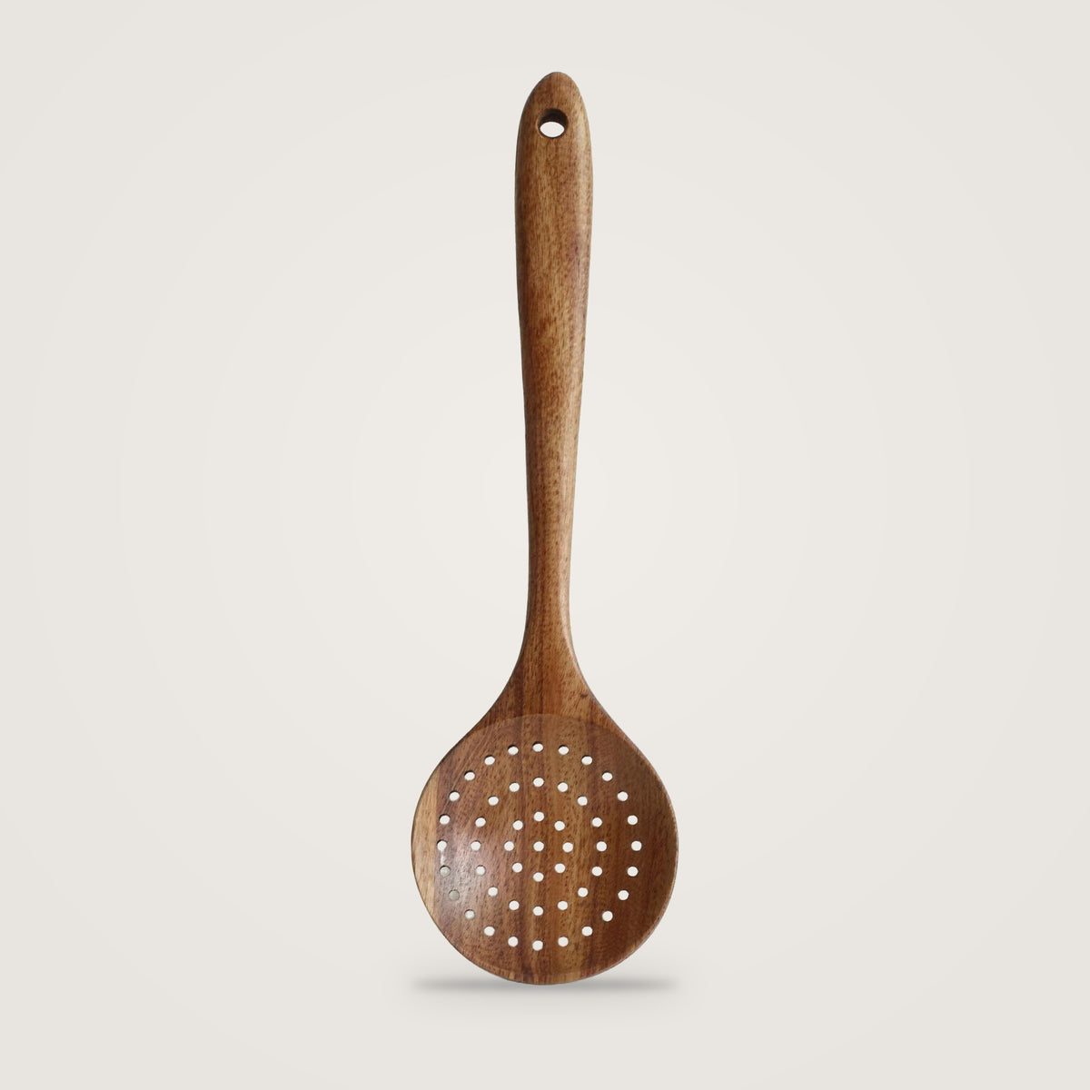 Wooden cooking utensils, Slotted Spoon option, on a plain light grey background